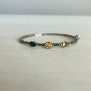 Silver bangle with tri colored stones